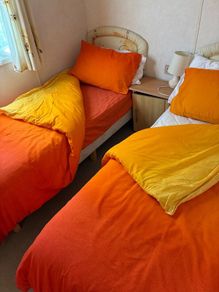 2  Single  bed duvets,  covers , sheets and delph