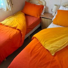 2  Single  bed duvets,  covers , sheets and delph