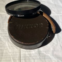 lens filter Vintage Nikon 52 mm Polarizing filter housed in its origiinal leather case