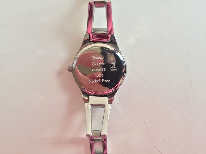 Telstar Quartz ladies silver watch with pink face- working perfectly new battery added.