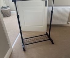 Adjustable clothes rail.