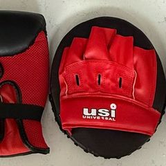 2 USI Universal boxing gloves and pads, unused.