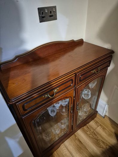 Wooden display cabinet with glass doors