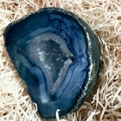 Polished blue agate geode slice.