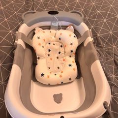 Baby bath with non-slip pillow and thermometer,