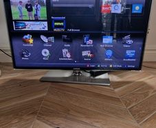 Samsung 42 inch TV and swivel stand.