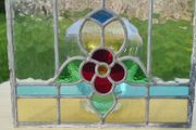 Antique leaded stained-glass panel in the Art Nouveau style.