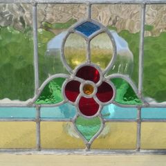 Antique leaded stained-glass panel in the Art Nouveau style.