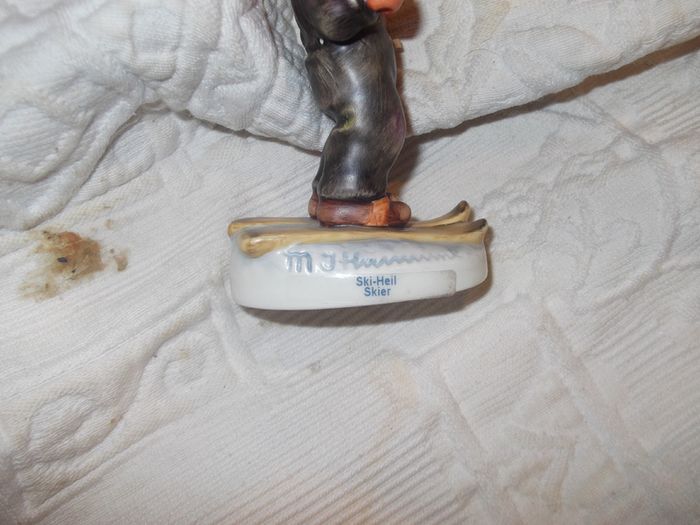 2 hummel figurines real hummel but are signed  ski heil skiar and for me