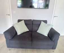 Modern two seater sofa. Offers welcome