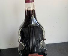Collectors Red Wine Bottle shaped like a Stradivarius