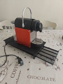 Nespresso coffee machine with pod holder