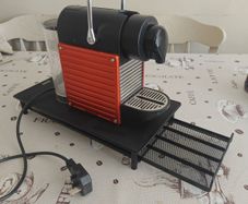 Nespresso coffee machine with pod holder