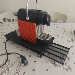 Nespresso coffee machine with pod holder