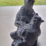 The figurine is a bears sculpture, manufactured by Wolf Originals in Canada. Image 2