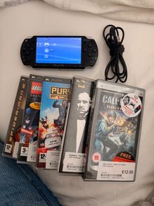 psp inc charger and 5 games