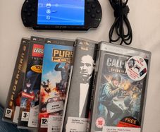psp inc charger and 5 games