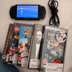 psp inc charger and 5 games