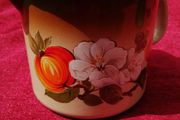 Retro Mid Century Milk pot or jug.  Enamel dark brown and orange with a floral pattern!