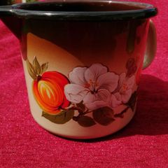 Retro Mid Century Milk pot or jug.  Enamel dark brown and orange with a floral pattern!