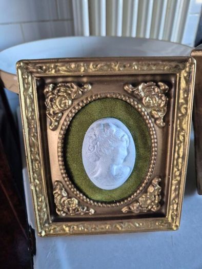 A pair of MidCentury Kelgin wall hanging Plaster  Vintage decorative pair of wall plaques featuring plaster cameos on green velvet background with ornate gold relief plaster frames