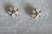 Pandora cherry blossom clips charm, featuring smooth cream enamel petals and a sterling silver beaded center very good condition