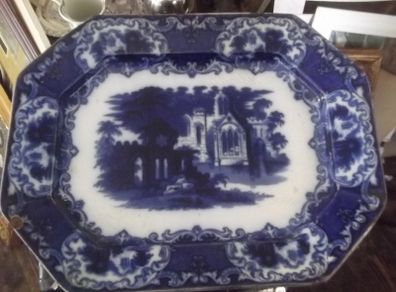 a large antique meat platter called flow blue date 1850