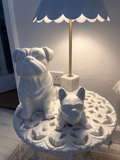 Two ceramic dog ornaments