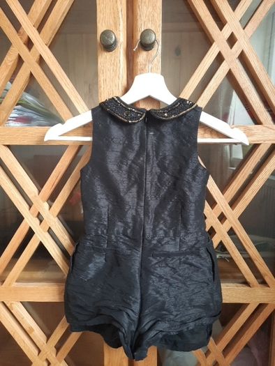 Girls black jumpsuit size 5 years from Next