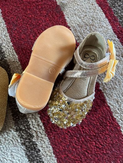 . Brand new in box , pair of girls gold shoes