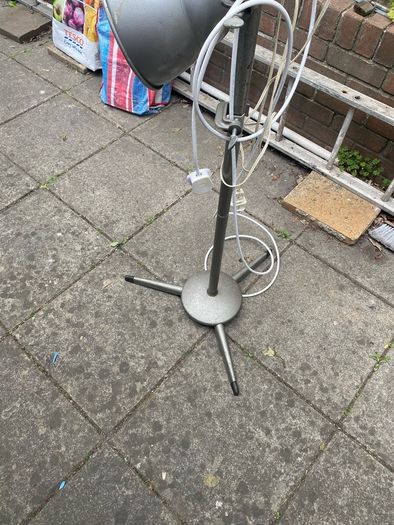 floor lamp This mid-century vintage industrial  floor lamp features twin adjustable reflectors (one fixed pole mount and one clamp-on mount).