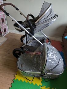 Pram with carry cot and foot muff