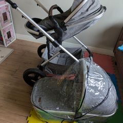 Pram with carry cot and foot muff