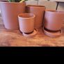 Set of 4 plastic planter pots with trays Image 2