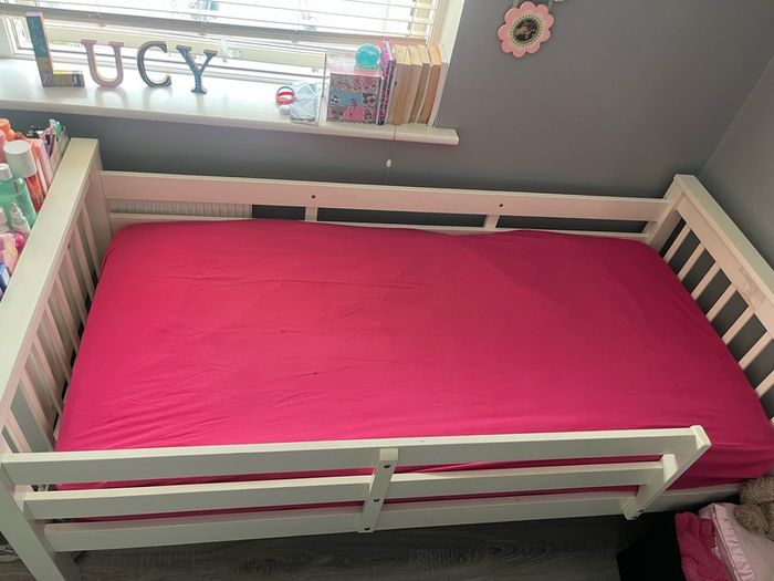 white wooden single bed