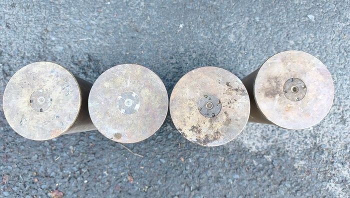 four empty brassartillery shell casings