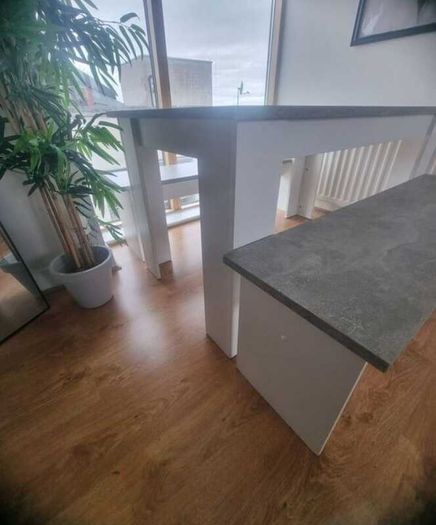 White and grey kitchen table with benches