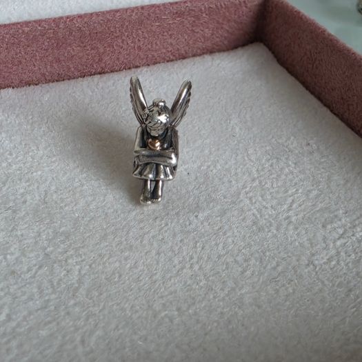 Pandora sitting pixie charm with 14k yellow gold heart  very good condition hallmarked