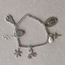 Vintage sterling silver bracelet with charms. Please note that only one charm is not sterling silver. It is a small size, approximately 16/17 cm. Image 4
