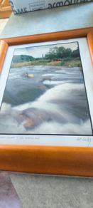 Framed Photograph art print depicting a rushing stream or waterfall, labeled -Glendalough - Co Wicklow- and hand-signed by the artist by Michael Walsh.