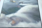 Framed Photograph art print depicting a rushing stream or waterfall, labeled -Glendalough - Co Wicklow- and hand-signed by the artist by Michael Walsh.