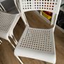Four white plastic IKEA chairs Image 2