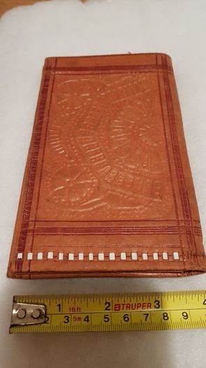 handcrafted made soft leather wallet,with designs ,, thank you,,was used,some wear and tear,,take as is ..
