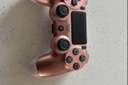 Rose gold ps4 controller ( mint condition and genuine )