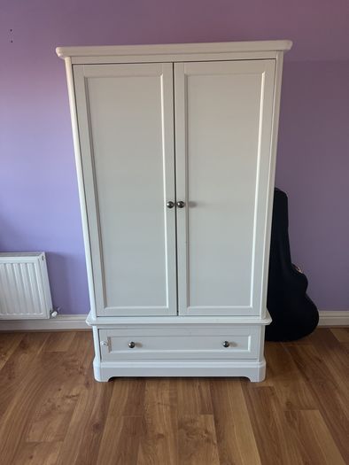 White double door high wardrobe with bottom drawer and shelf