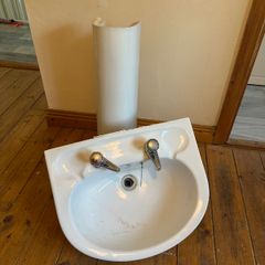 Pedestal basin with taps