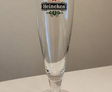 Set of 4 matching vintage Heineken stemmed beer glasses.