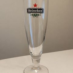 Set of 4 matching vintage Heineken stemmed beer glasses.