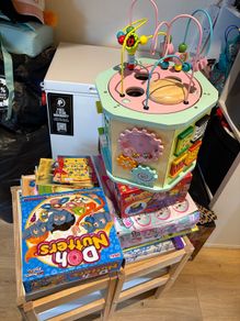 Kids table and chairs and mix of toys and books all have to go together