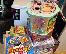 Kids table and chairs and mix of toys and books all have to go together